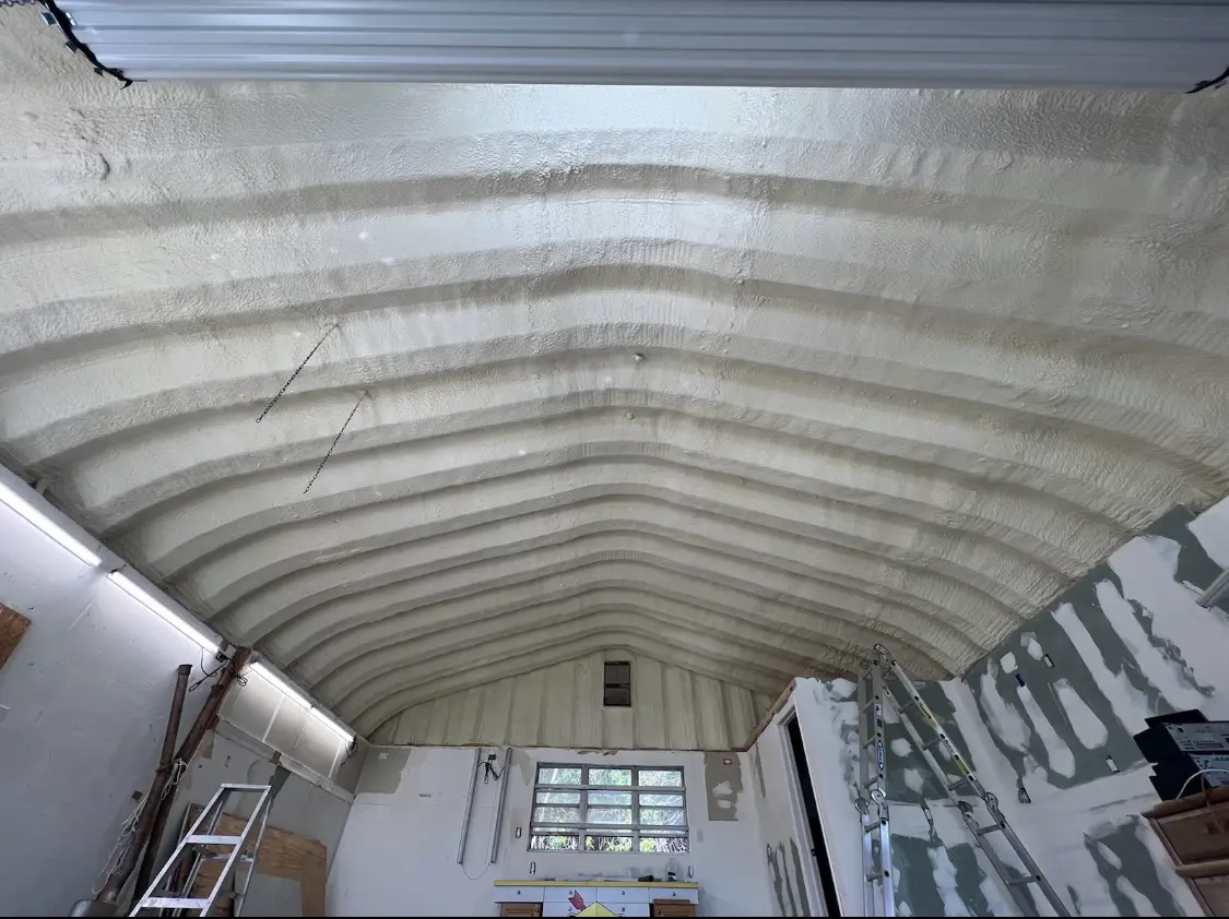 Spray polyurethane foam applied to the underside of a metal roof deck in Weddington